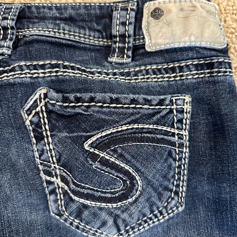 Silver jeans.